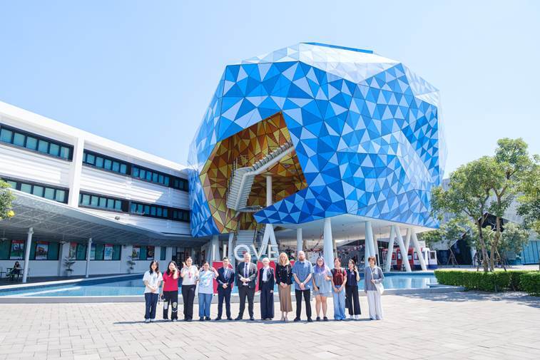 Representatives from Manchester Metropolitan University pose for a photo with students enrolled in the university’s program at BUV in 2026. Photo courtesy of BUV