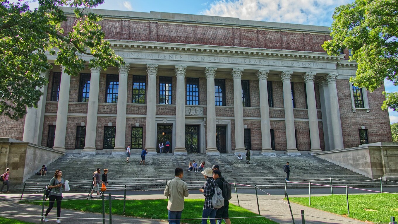 People walk outside Widener Library at Harvard University in Cambridge, Massachusetts. Photo by Unsplash