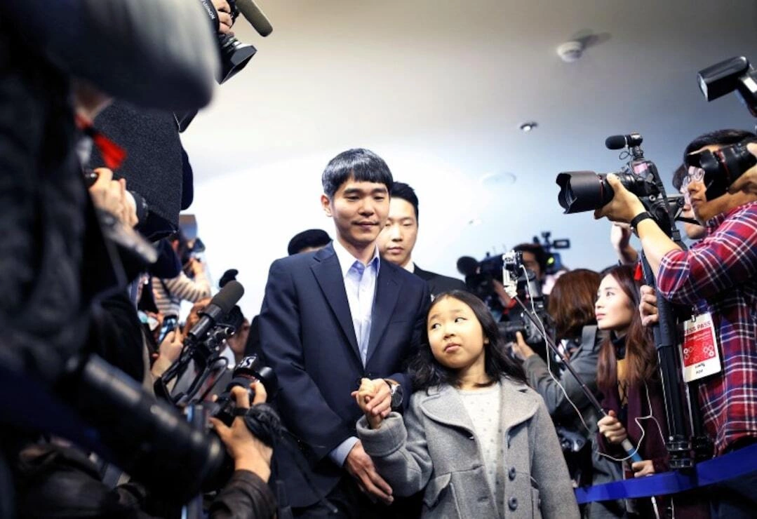 The world’s top Go player Lee Sedol walks with his daughter Lee Hye-lim as he heads for the venue of the last match of the Google DeepMind Challenge Match against Googles artificial intelligence program AlphaGo in Seoul, South Korea, March 15, 2016. Photo by Reuters