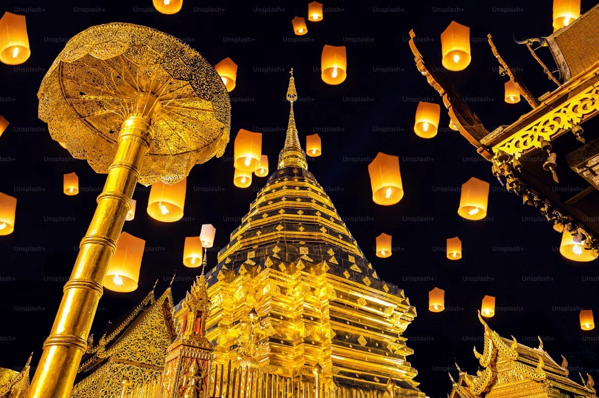 Wat Phra That Doi Suthep temple illuminated by lanterns during a festival in Chiang Mai, Thailand. Photo by Unsplash
